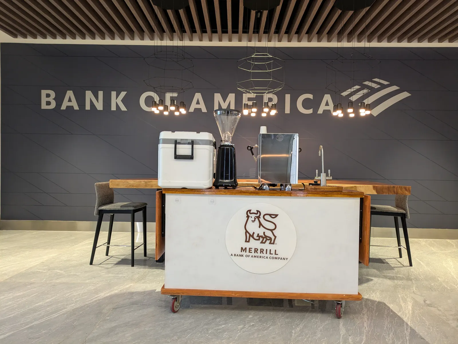 Mobile coffee cart branded for a Merrill (Bank of America) corporate event in a financial district office