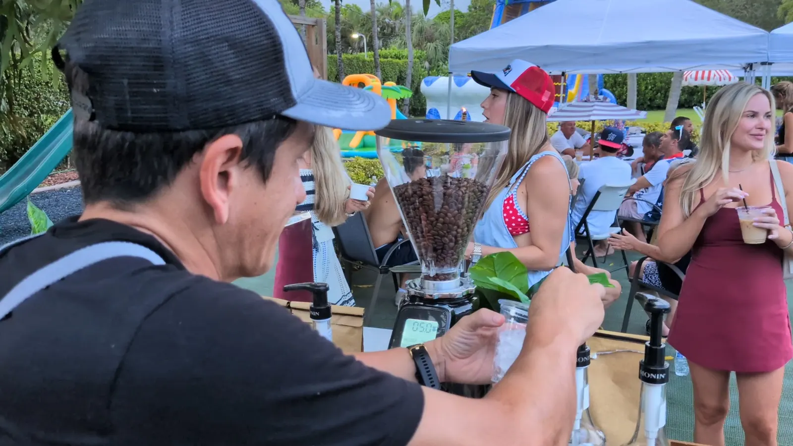 Guests gathered around the Luisa Coffee cart at an outdoor private party