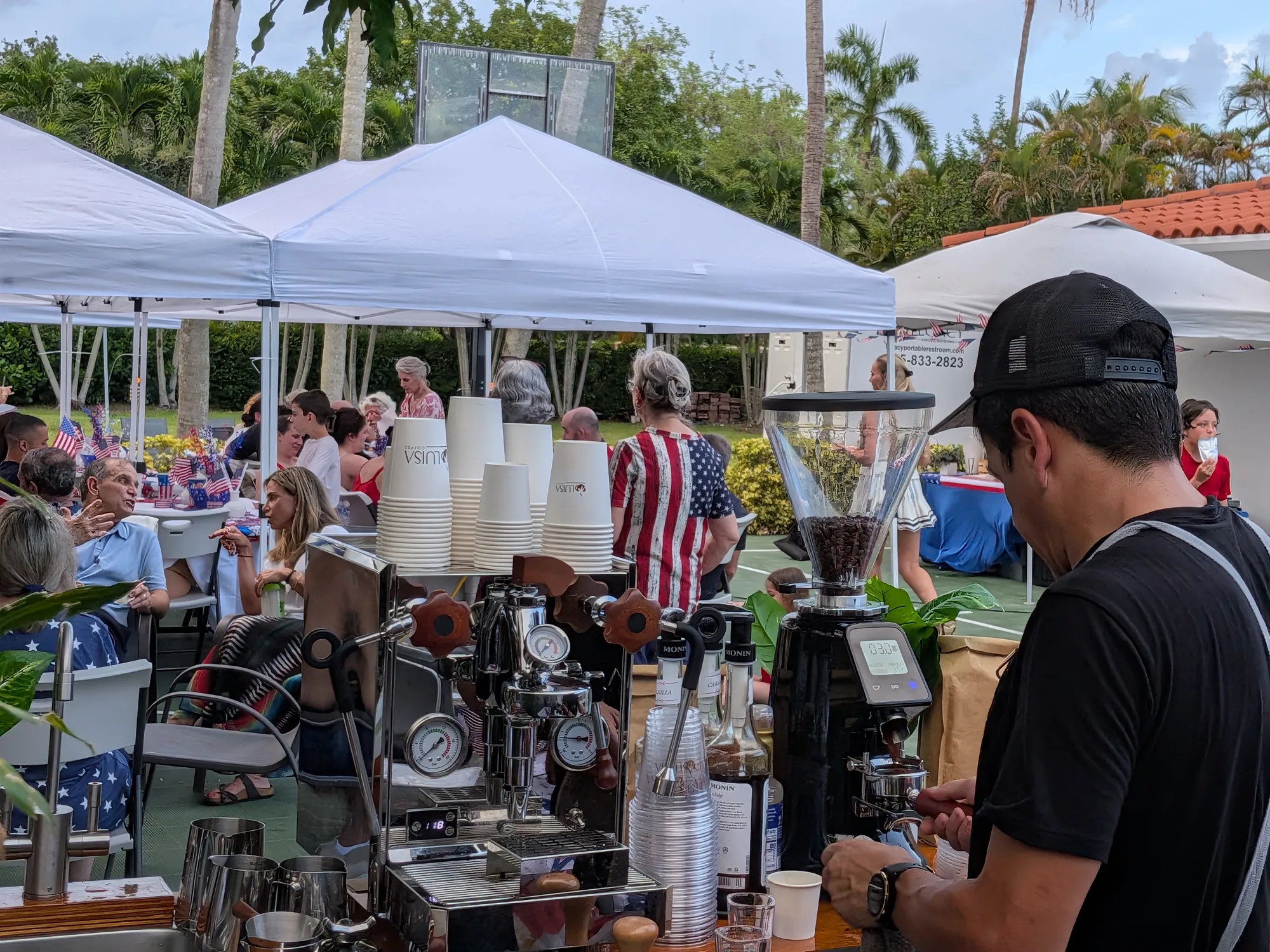 Miami Coffee Cart barista serving guests from a fully equipped espresso cart at a Fourth of July event